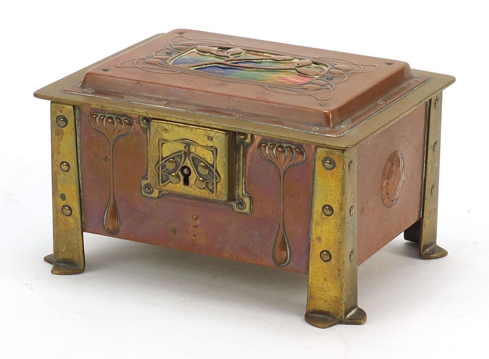 Arts & Crafts enamel, copper and brass casket with embossed floral motifs raised on four stylised