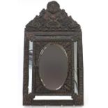 Classical embossed brass wall mirror with bevelled edge and cupboard enclosing two clothes