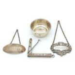 Silver objects including two decanter labels, a folding button hook and scissors, various hallmarks,