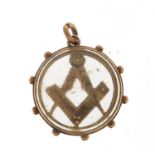 Victorian 9ct gold masonic pendant with bevelled glass, 2cm in diameter, 4.8g