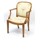 Yew wood framed open armchair with floral upholstery, 90cm high