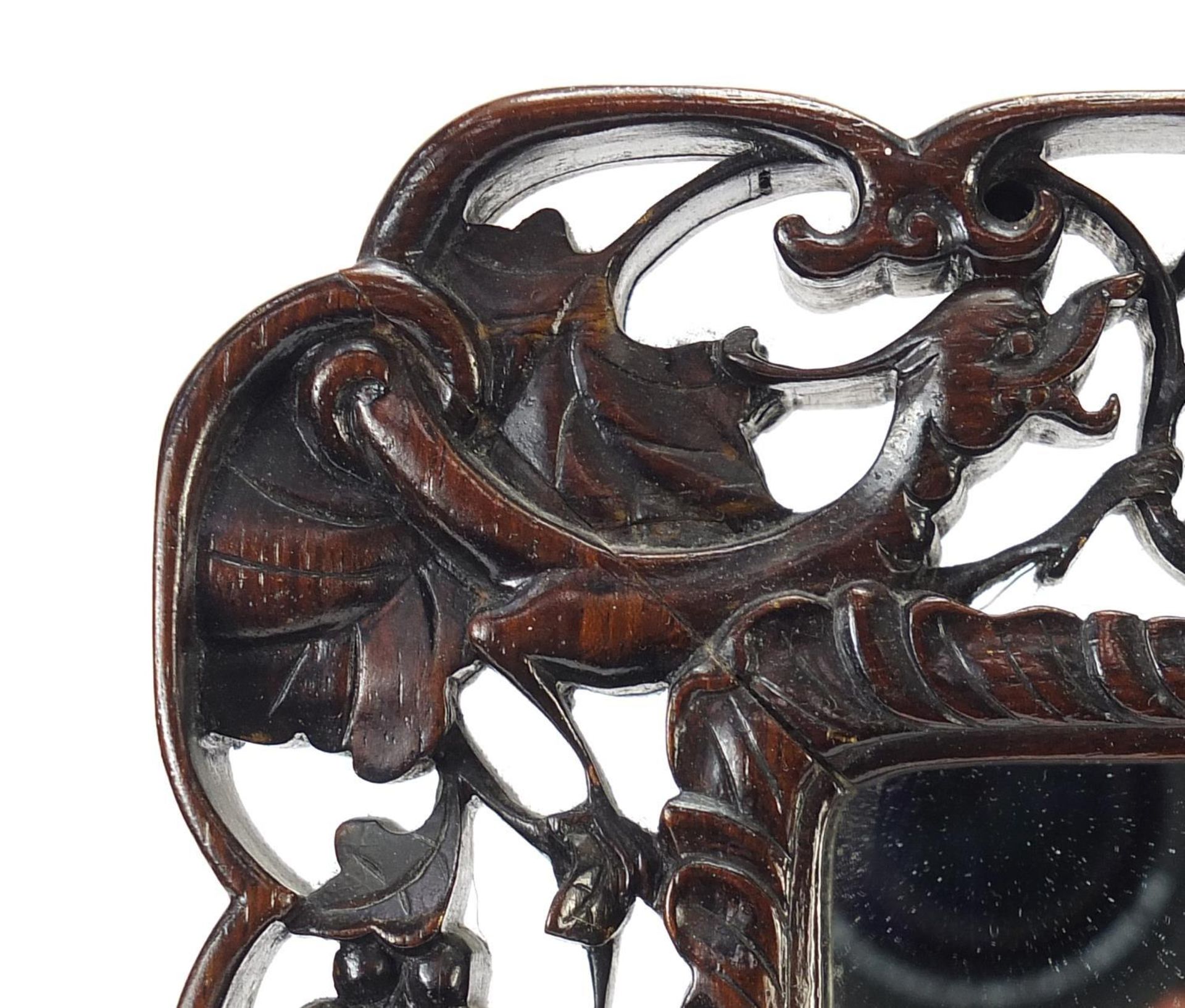 Chinese hardwood easel toilet mirror carved with bats, rats and mythical animals amongst berries and - Image 3 of 6