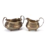 Solomon Royes & John East Dix, George III silver sugar bowl and milk jug with leaf design handles,