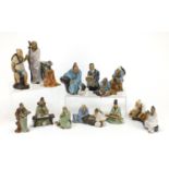 Collection of Chinese mud men pottery figures, the largest 21.5cm high