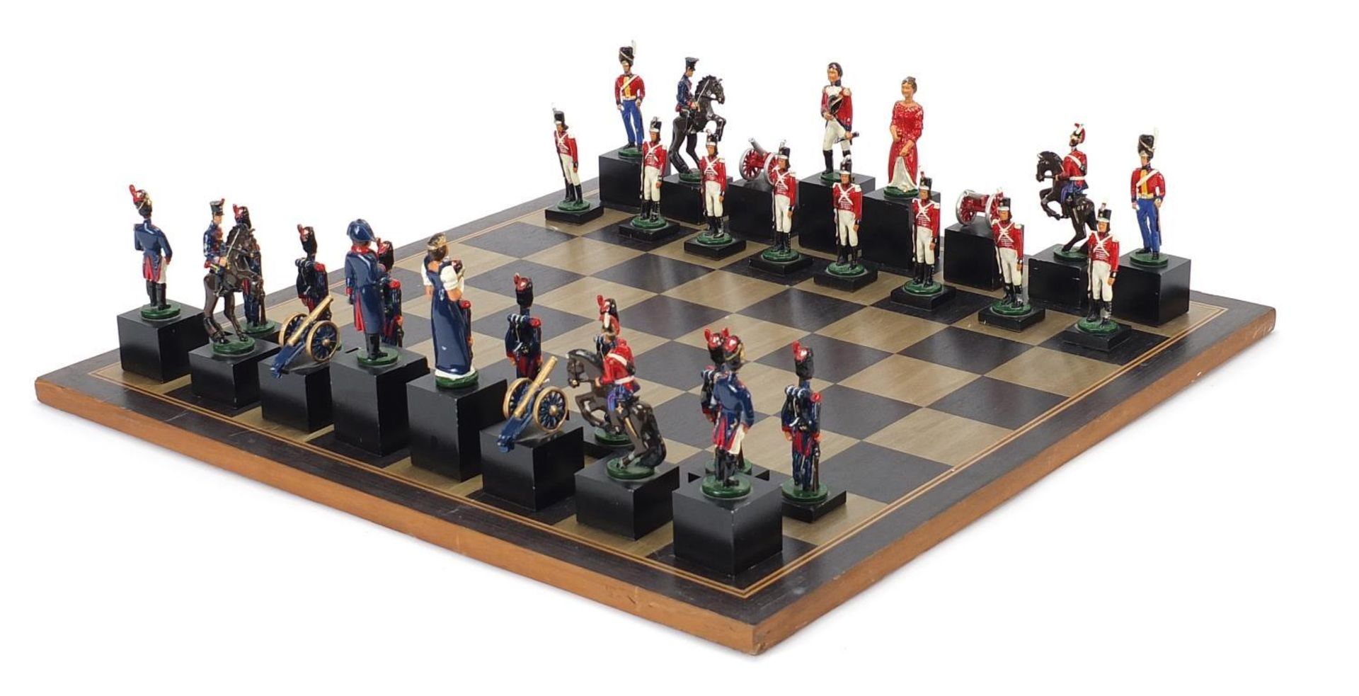 Hand painted metal Waterloo chess set with board, the largest pieces each 11cm high, the board