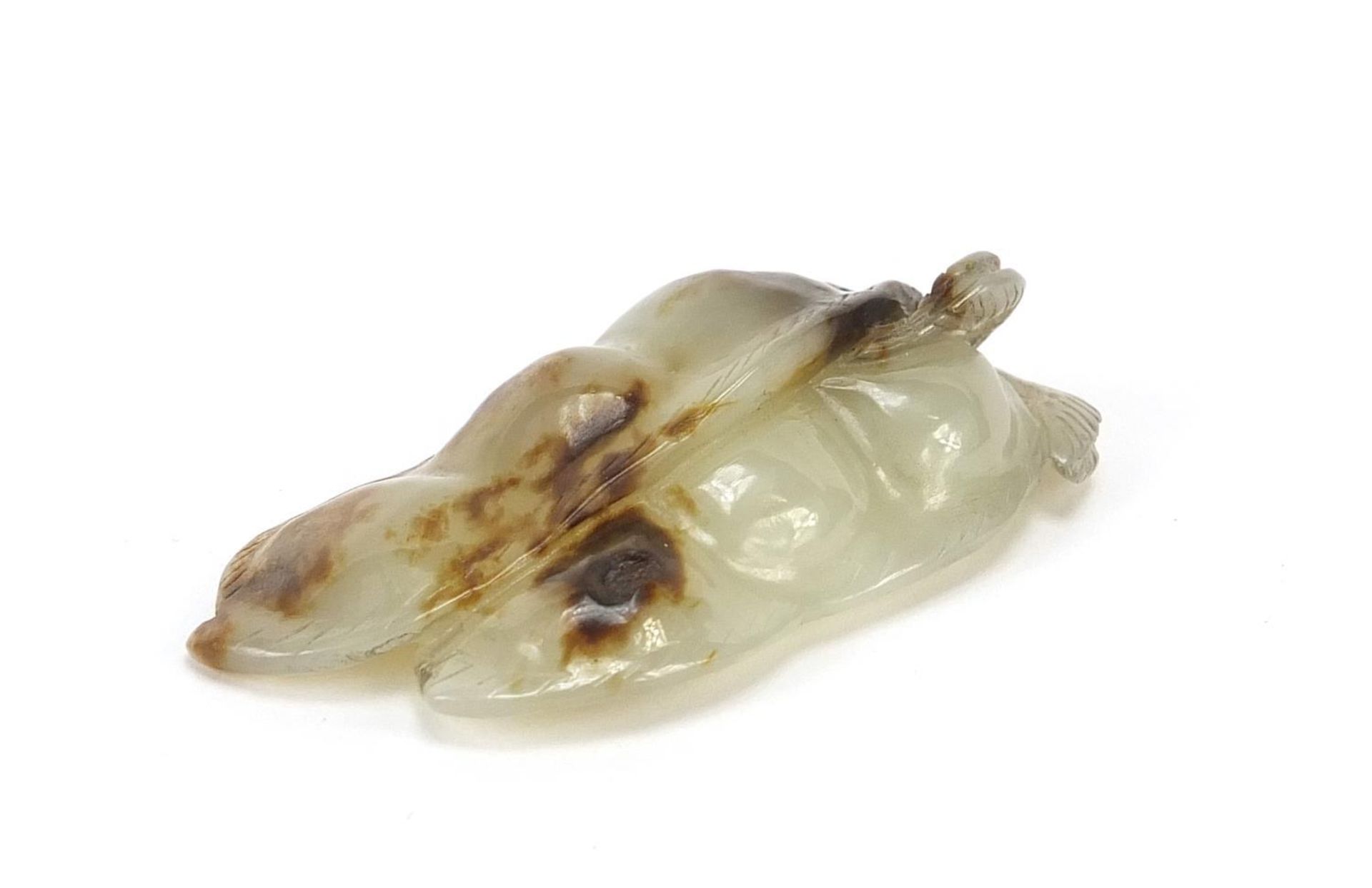 Good Chinese white and russet jade carving of two beans, 5.5cm in length