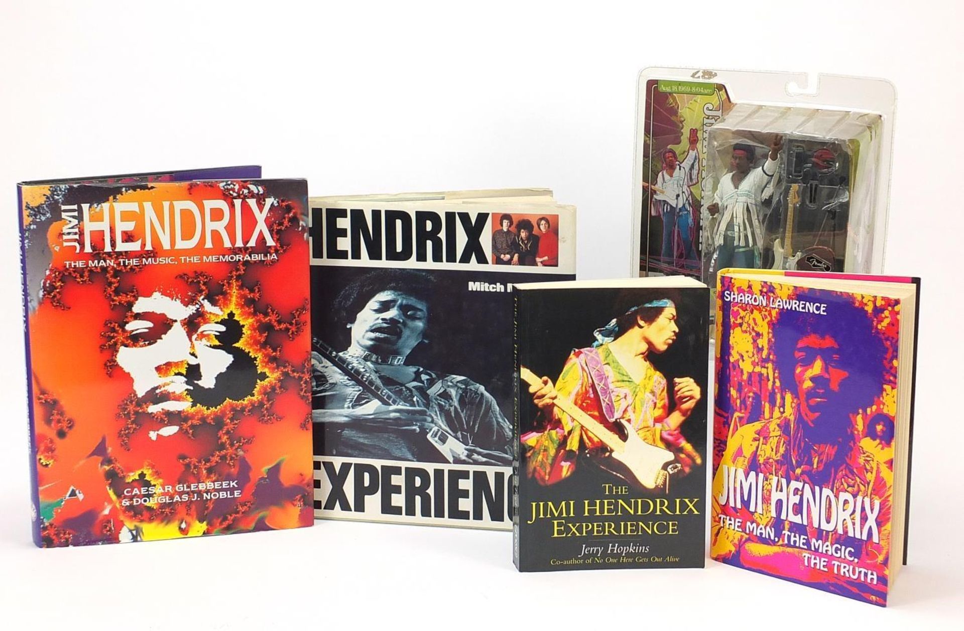 Jimi Hendrix memorabilia including a Spawn action figure and hardback books