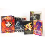 Jimi Hendrix memorabilia including a Spawn action figure and hardback books