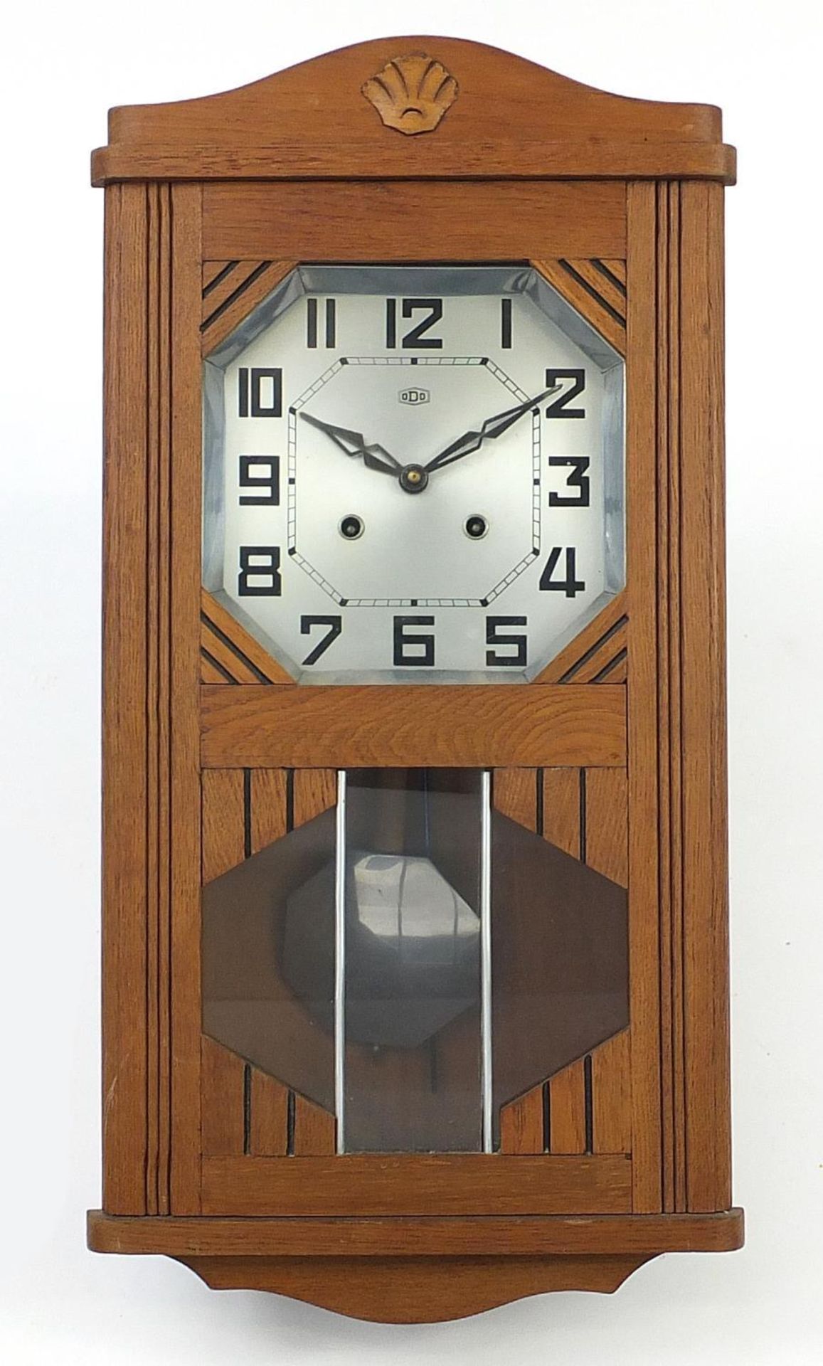 French Art Deco oak wall clock with silvered dial having Arabic numerals, 61.5cm high