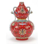 Chinese porcelain red ground double gourd vase with ruyi handles, hand painted with flower heads and