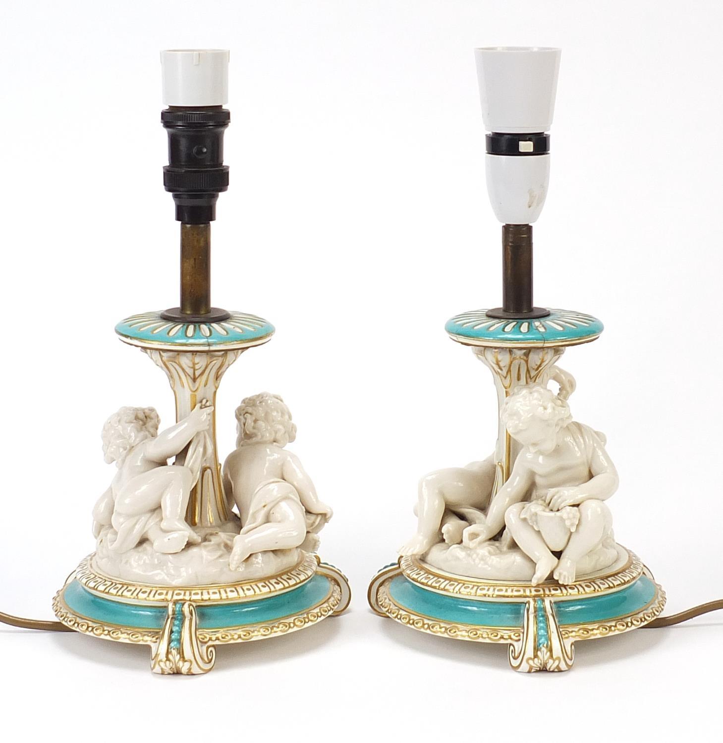Pair of 19th century turquoise ground porcelain Putti design table lamps, each overall 30.5cm high - Image 2 of 3