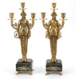 Large pair of French Empire style gilt bronze figural three branch candelabras raised on square