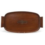 Military interest hardwood tray with twin handles and carved crest, 60cm in length