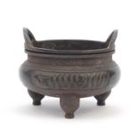 Chinese Islamic patinated bronze tripod censer, 14.5cm in diameter