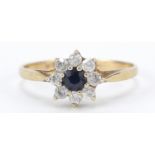 9ct gold blue and white sapphire flower head ring, size L, 1.4g