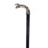 Ebonised walking stick with silver coloured metal hand design handle, 88cm long