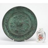 Chinese archaic style bronze mirror and a snuff bottle internally hand painted with figures, the
