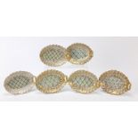 Set of six naturalistic porcelain leaf dishes hand painted with flowers, each 14.5cm wide