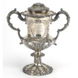 Good Victorian silver twin handled trophy and cover, embossed with agricultural scenes, HW&Co