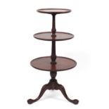 Mahogany three tier dumb waiter with ball and claw feet, 110cm high, the largest tier 55cm in
