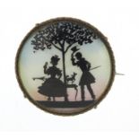 Continental silver and guilloche enamel brooch depicting a courting couple under a tree, 3.8cm in