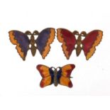Three vintage enamelled butterfly brooches, the largest 3.5cm wide