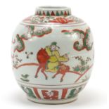 Chinese porcelain jar hand painted in the wucai palette with figures on horseback in a palace