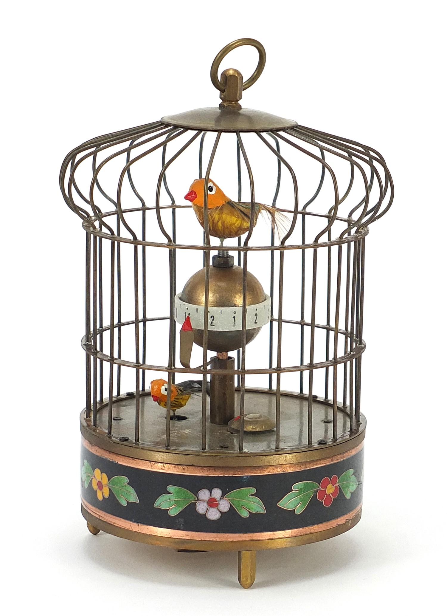 Brass clockwork automaton bird cage alarm clock with cloisonné band, 19.5cm high