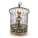 Brass clockwork automaton bird cage alarm clock with cloisonné band, 19.5cm high