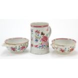Chinese porcelain tankard and two dishes, each hand painted in the famille rose palette with