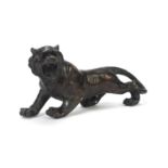 Large Japanese patinated bronze tiger, 31cm in length