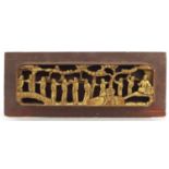 Chinese partially gilt wood panel carved with figures, 40cm x 16cm