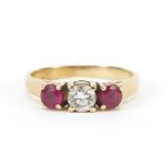 14ct gold diamond and ruby three stone ring, the diamond approximately 4.3mm in diameter, size N,