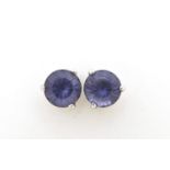 Pair of 14ct gold purple stone stud earrings, 6mm in diameter, 1.1g