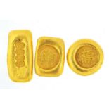 Three Chinese gold coloured metal ingots, the largest 4.5cm wide