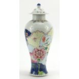 Chinese porcelain baluster vase and cover hand painted in the Wucai palette with flowers, 29cm high