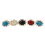 Five silver cabochon stone brooches including turquoise and mother of pearl, 2.8cm wide, 24.5g