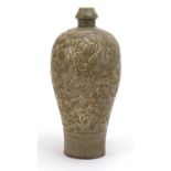 Korean celadon glaze vase decorated with in relief with phoenixes amongst flowers, 27.5cm high