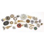 Vintage and later brooches including some jewelled and enamelled, the largest 8cm in length