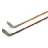 Two vintage wooden shafted aluminium headed putters comprising The Northwood model A Flat Lie and