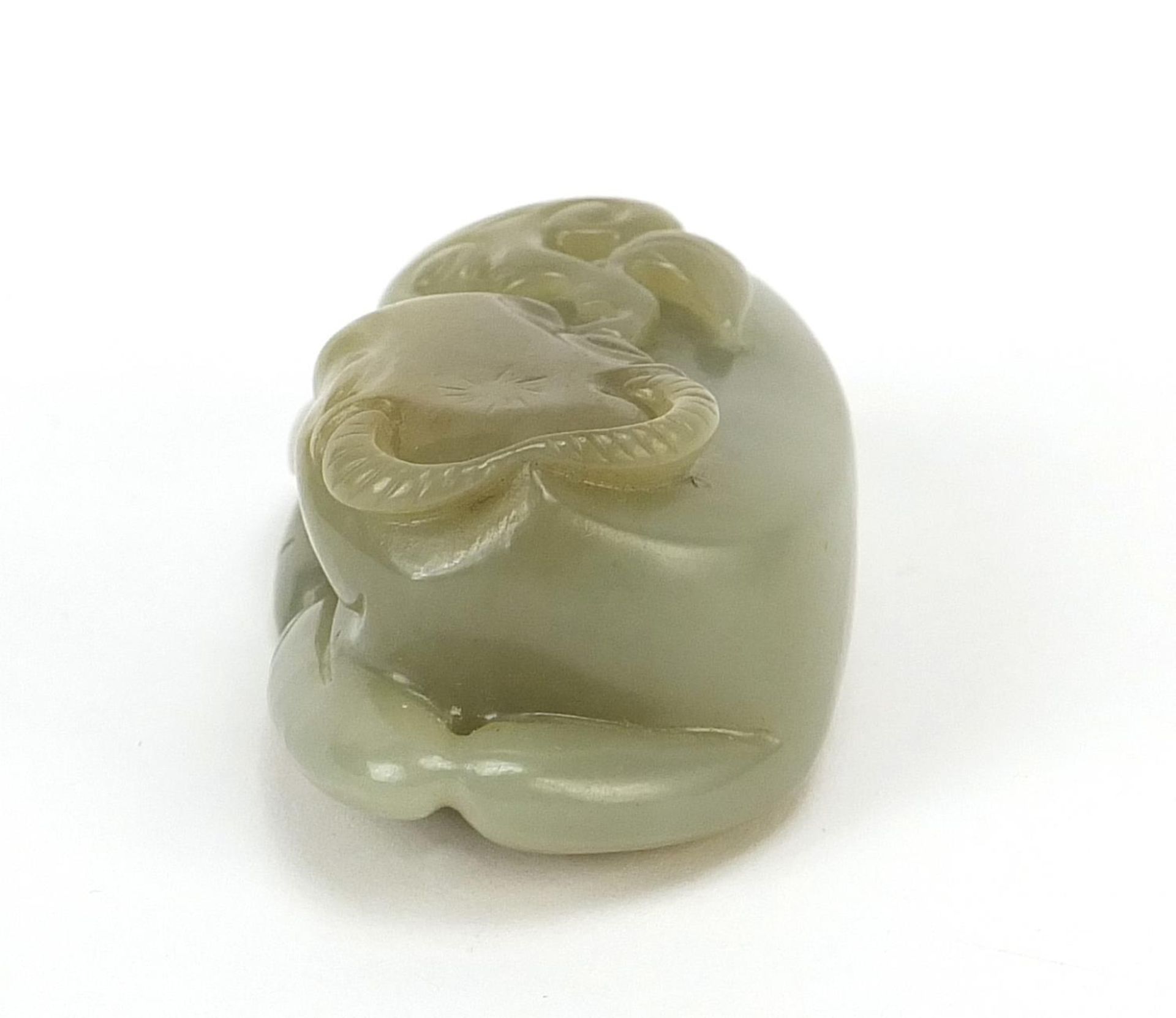 Chinese celadon and russet jade carving of a buffalo, 7cm wide - Image 3 of 7