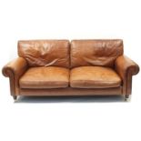 Brown leather two seater settee, 210cm wide