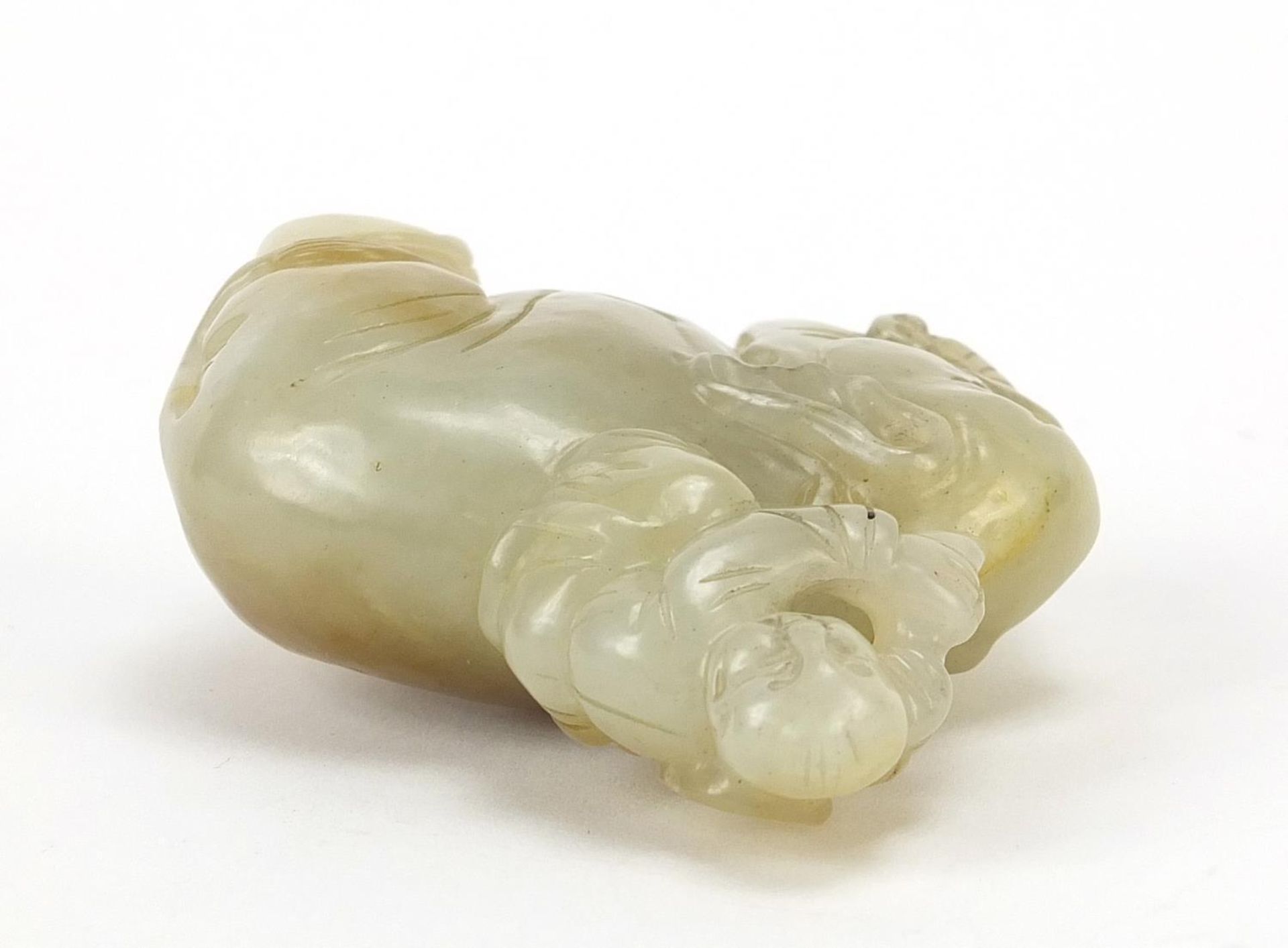 Chinese celadon and russet jade carving of a boy holding a ruyi sceptre on elephant, 6.5cm wide - Image 6 of 7
