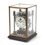 Champlevé enamel rolling ball clock with enamel dial having Roman numerals and glass display case,