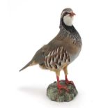 Taxidermy Red Legged partridge on a naturalistic base, 29.5cm high