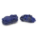 Two Chinese lapis lazuli pendants including one carved with a dragon, the largest 7.5cm high