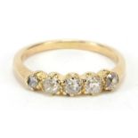 18ct gold graduated diamond five stone ring, housed in a velvet and silk lined leather box, size