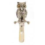 Novelty sterling silver babies' rattle in the form of an owl, with mother of pearl handle, 8.5cm