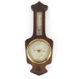 Negretti and Zambra, carved oak wall barometer with thermometer having silvered dials numbered 6602,