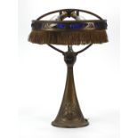 Art Nouveau patinated bronze table lamp with blue rough cut stone type mounts and remnants of